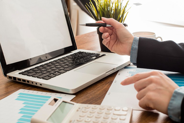 businessman-with-laptop-and-calculator-at-the-office.jpg
