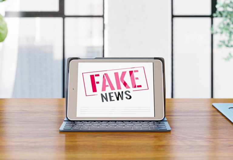 front-view-laptop-desk-with-fake-news.jpg