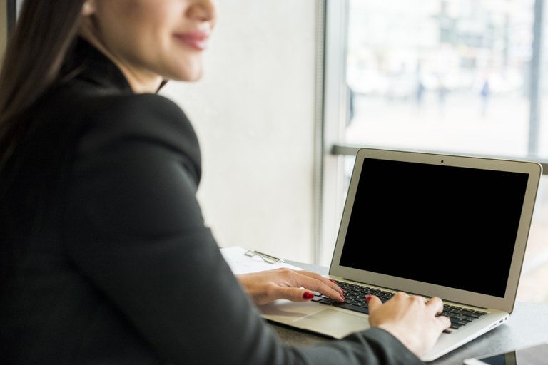 brunette-businesswoman-using-laptop.jpg