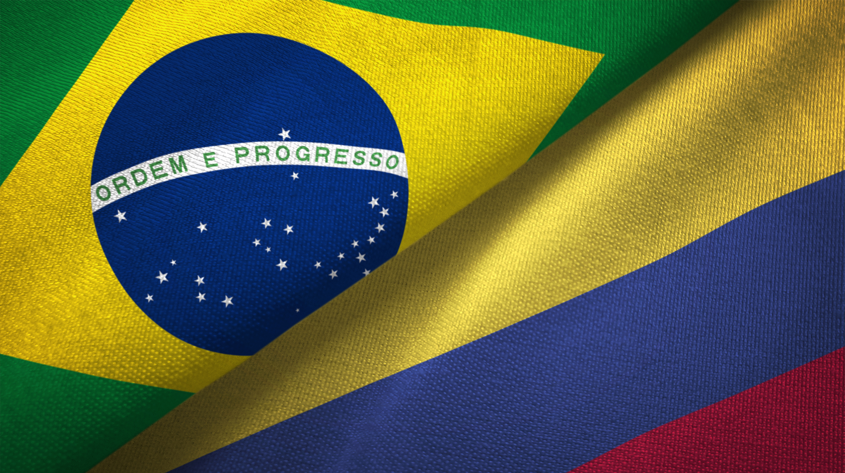 Ilustração com as bandeiras do Brasil e da Colômbia dividindo o mesmo quadro