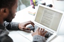 foto-recortada-de-homem-jovem-serio-sentado-no-escritorio-coworking_171337-17650.jpg