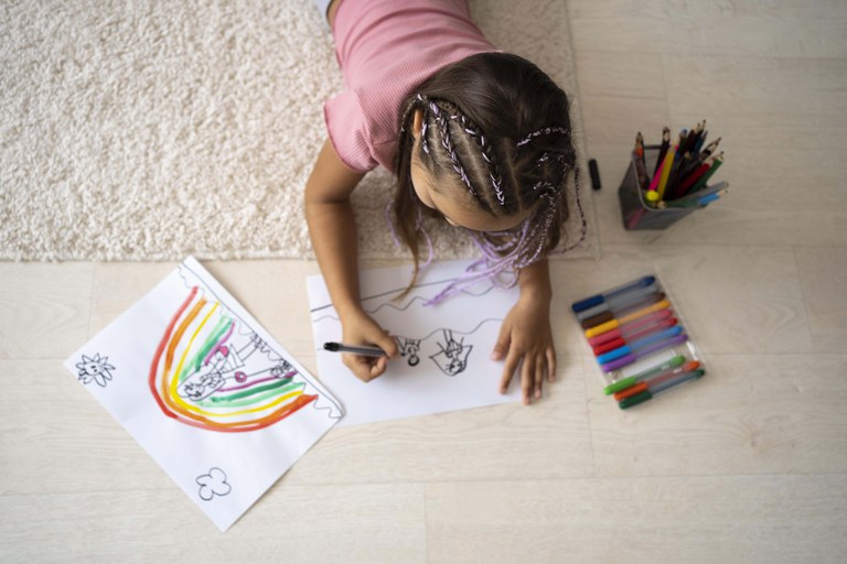 adorable-little-girl-drawing-paper-home.jpg