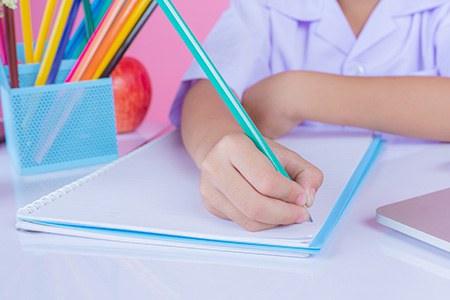 children-write-book-gestures-pink-background.jpg