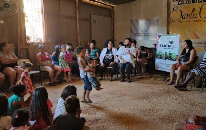 Women and children gathered at the Unified Center of the Favelas conference. Photo: Press Release