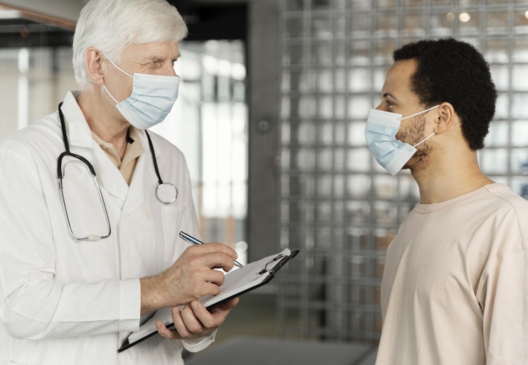 male-doctor-talking-with-patient.jpg