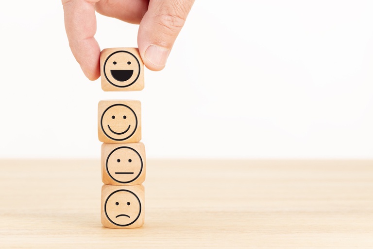 customer-service-evaluation-and-satisfaction-survey-concept-hand-picked-the-happy-face-emoticon-on-wooden-blocks (1).jpg