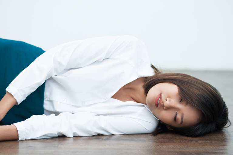 closeup-young-asian-woman-sleeping-floor.jpg