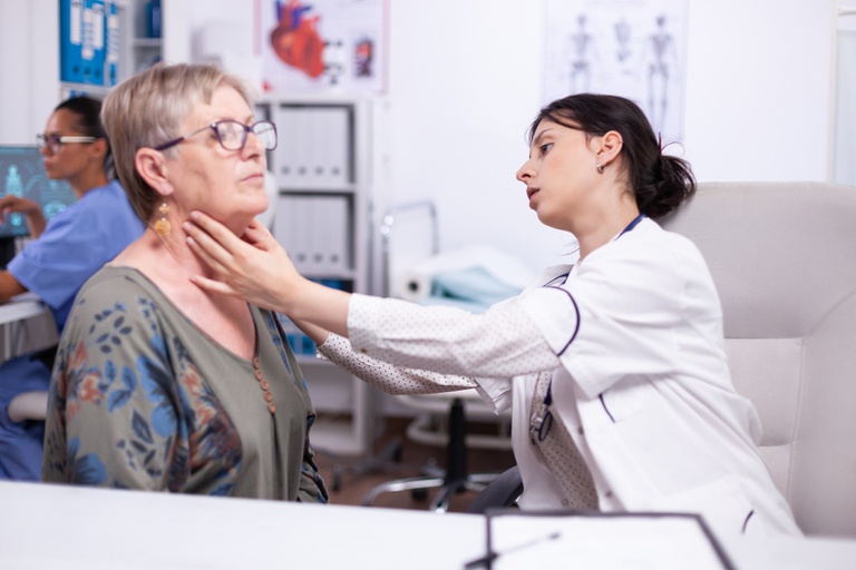 young-medic-palpating-neck-of-senior-woman-elderly-patient-visiting-doctor-at-hospital-checking-thyroid-throat-touching-health-at-clinic-healthcare-specialist-med.jpg