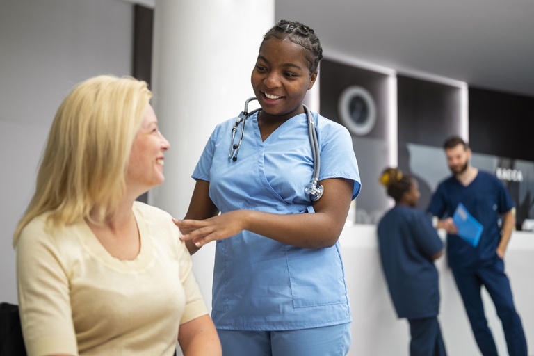 medium-shot-nurse-talking-patient(1).jpg