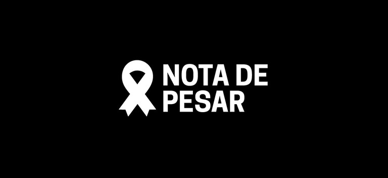 Fundo preto com símbolo de tristeza escrito "nota de pesar"