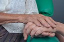 young-woman-holding-elderly-woman-s-hand.jpg