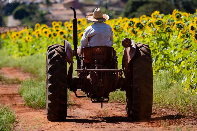 beautiful-shot-of-a-person-on-a-tractor-driving-ne-2023-11-27-05-26-16-utc.jpg