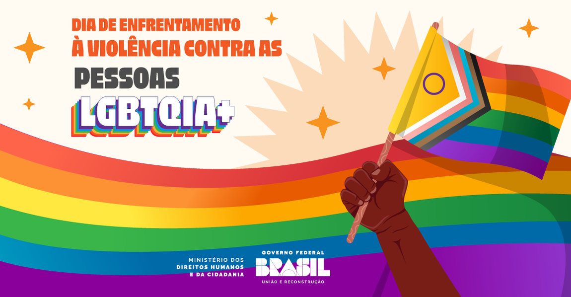 Banner retangular com as cores das bandeiras LGBTQIA+, Texto da imagem: Dia de Enfrentamento à Violência contra as Pessoas LGBTQIA+. Abaixo a assinatura do Ministério dos Direitos Humanos e da Cidadania e a logo do Governo Federal