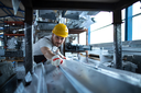 factory-worker-working-warehouse-handling-metal-material-production.png