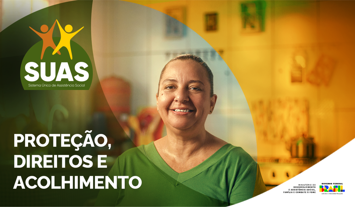 No banner do programa SUAS, há uma imagem de uma mulher sorrindo. Abaixo da imagem, está escrito em letras grandes e legíveis: 'Proteção, Direitos e Acolhimento'.