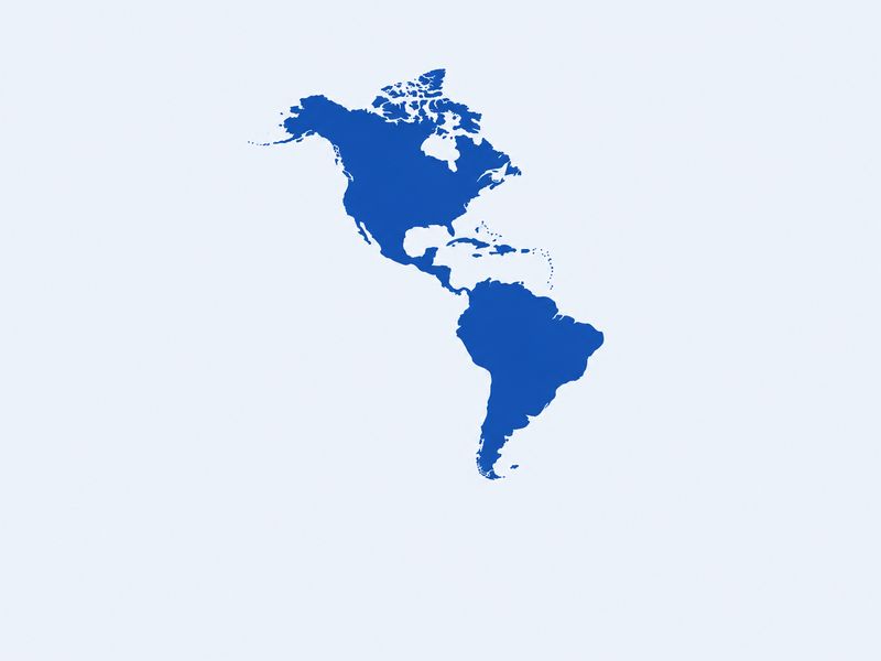 Silhueta azul das Américas e do Caribe sobre fundo azul-claro
