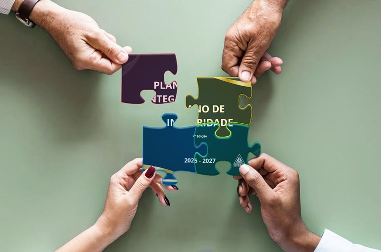 Foto mostra uma arte com quatro mãos e um quebra-cabeças