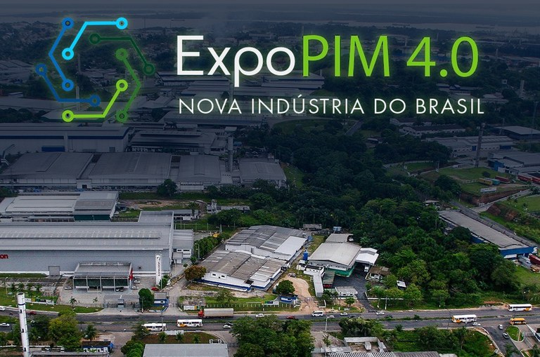 Foto mostra frases, símbolo e uma imagem aérea de um parque industrial