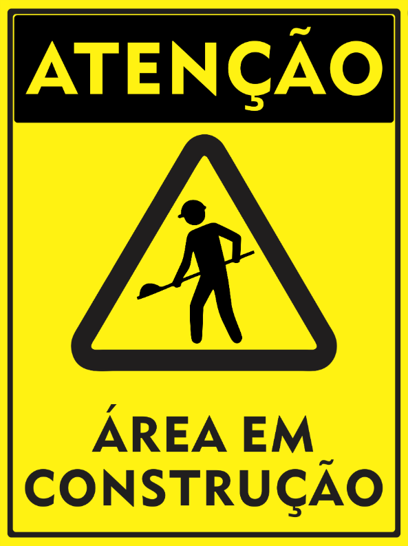 Imagem imitando uma placa de trânsito triangular, com fundo amarelo e elementos na cor preta, onde se vê, no interior do triângulo, o ícone de um trabalhador com capacete de segurança e uma pá na mão, e fora do triângulo as inscrições 'Atenção" - que está na parte superior - e 'Área em Construção', que está no rodapé.