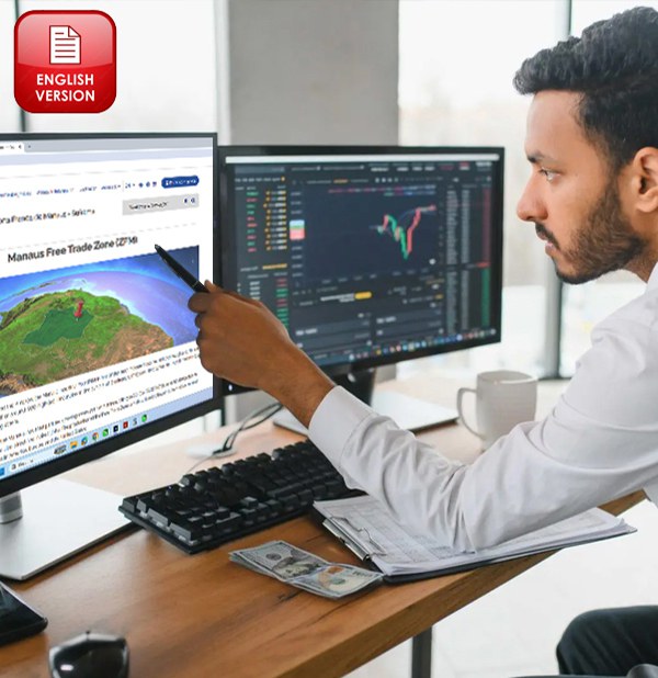 A man holds a pen while pointing at a computer screen.