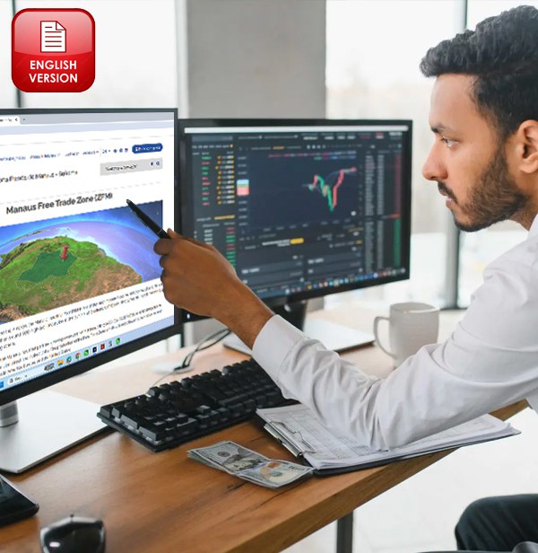 A man holds a pen while pointing at a computer screen.